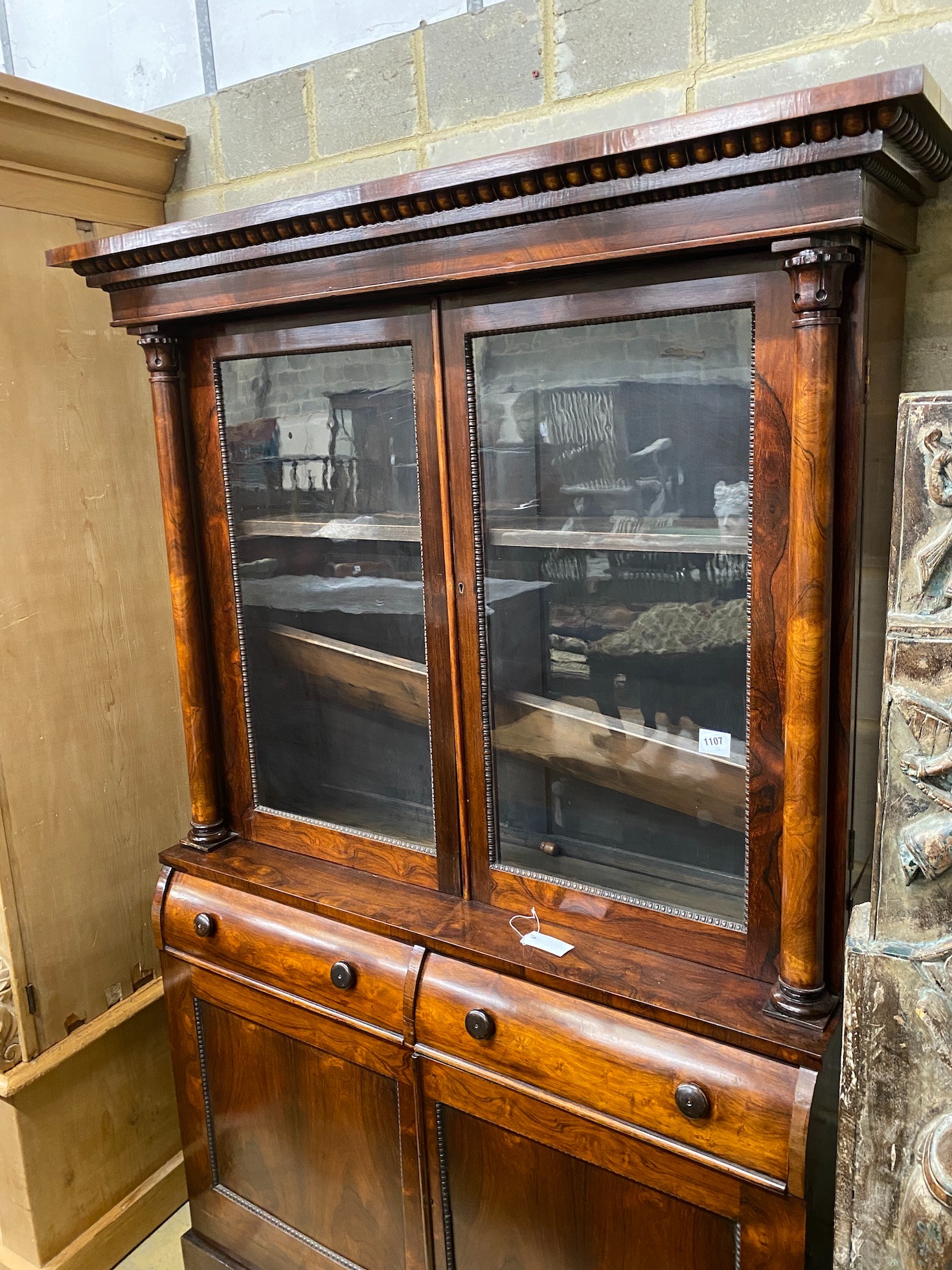 An early Victorian rosewood bookcase, width 127cm, height 190cm